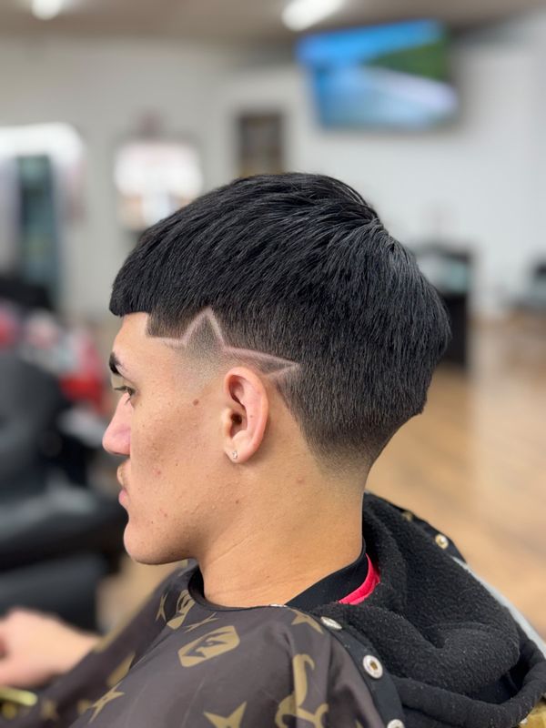 Crop with a mid fade and a hair design