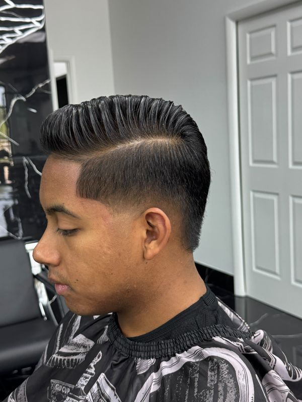 Pompadour with a hard part, side view